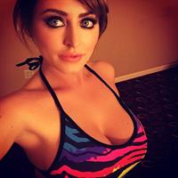 Sophie Dee in a bikini taking a selfie