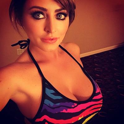 Sophie Dee in a bikini taking a selfie