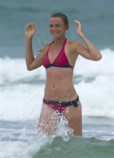 Daniela Hantuchova bikini beach surfing candids in Brisbane, Australia, December 26, 2012 