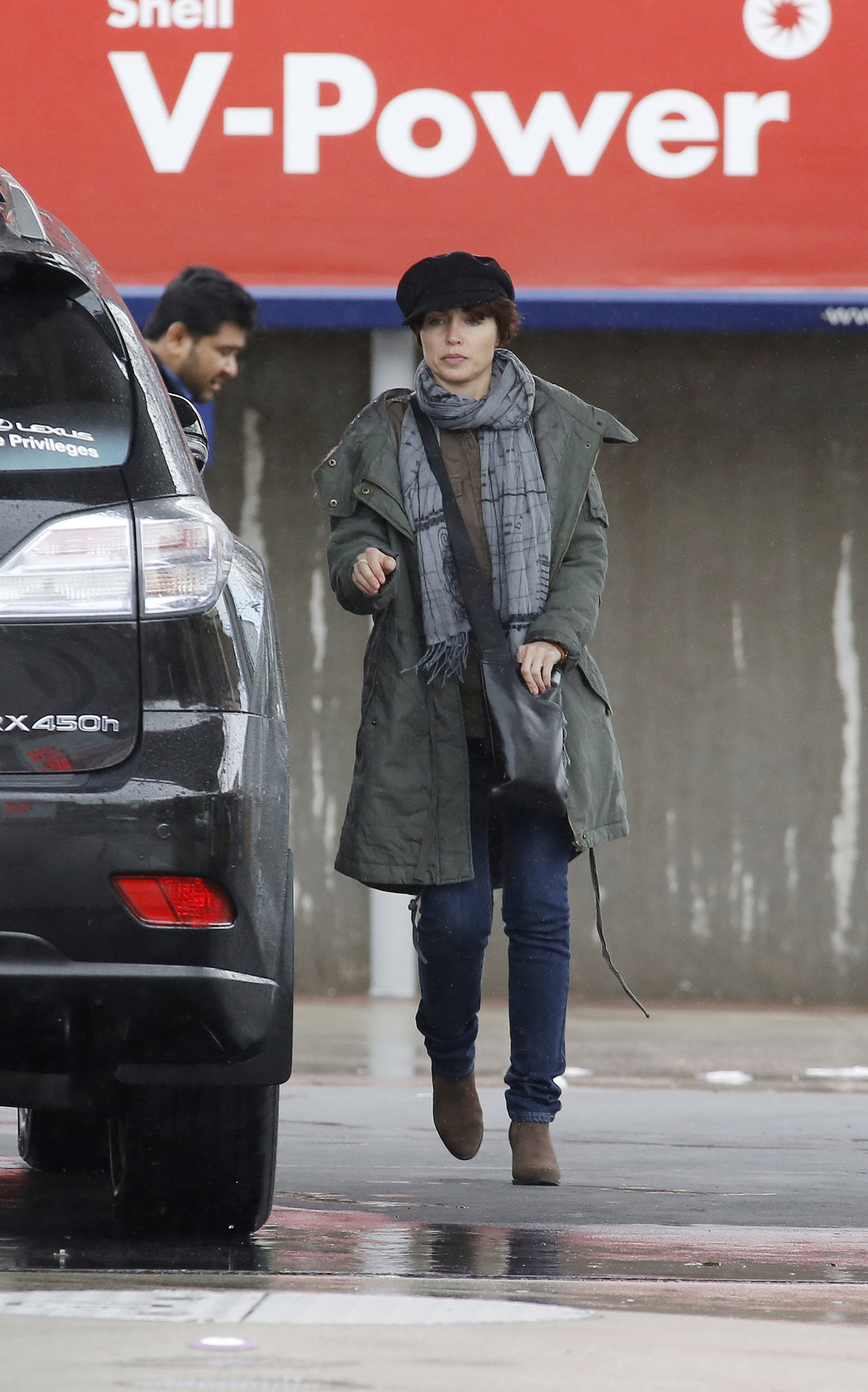 Dannii Minogue - Pictured getting a little wet while filling up on petrol - 09th August 2012