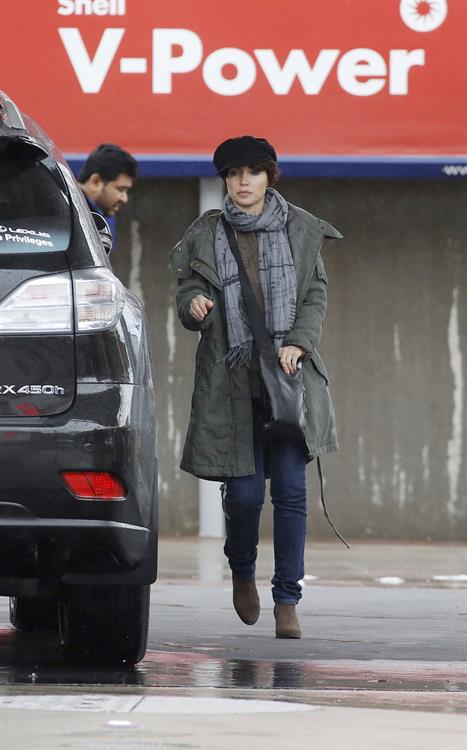 Dannii Minogue - Pictured getting a little wet while filling up on petrol - 09th August 2012