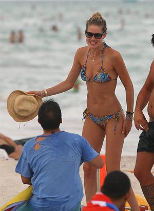 Doutzen Kroes bikini candids on the beach in Miami, Florida Augusts 15, 2012