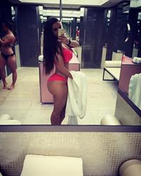 Ines Helene in a bikini taking a selfie