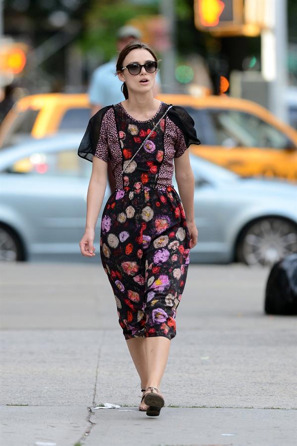 Keira Knightley wears a dark floral dress while strolling in New York City on August 7, 2012