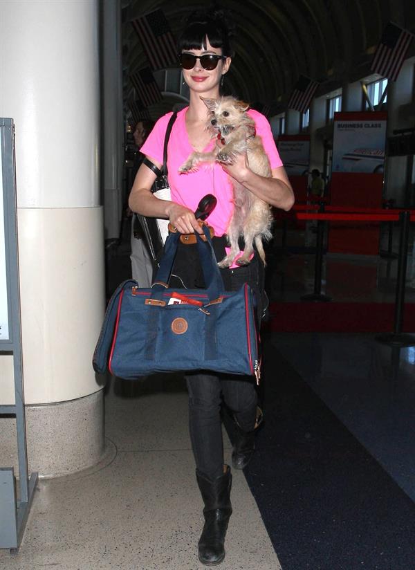 Krysten Ritter - Prepares to leave LAX in Los Angeles, California - June 8, 2012 