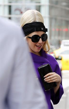 Lady Gaga holds her latest Vogue magazine cover September 2012 Issue close to her chest while out in New York City to visit a friend (07 August 2012).