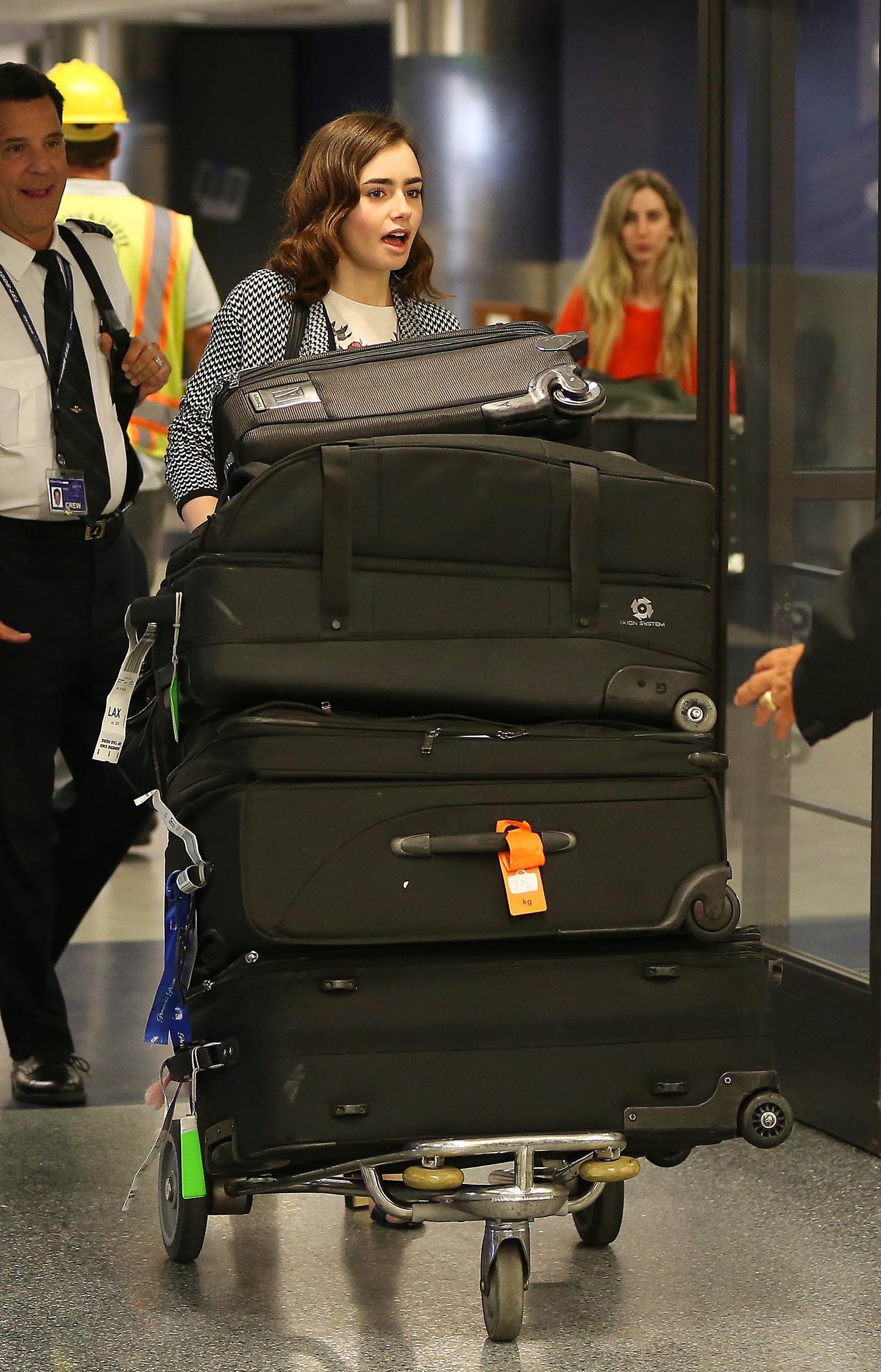 Lily Collins - LAX Airport 8/27/13