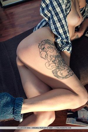 Callista Topless Pictures Callista flaunts her sexy, tattooed legs and delectable pussy on the floor.