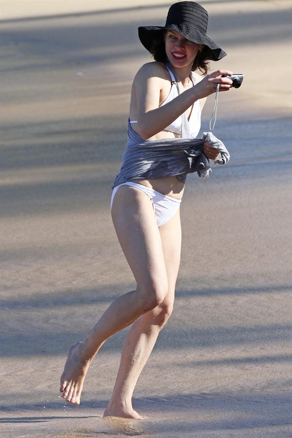 Milla Jovovich on the beach in a bikini on New Years Eve in Maui, Hawaii December 31, 2012 