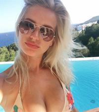 Jess Davies in a bikini taking a selfie