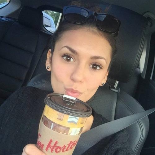 Nina Dobrev taking a selfie