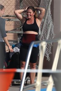 Nicole Eggert prepares for 'Splash' (sports bra/wetsuit) 6.2.2013 