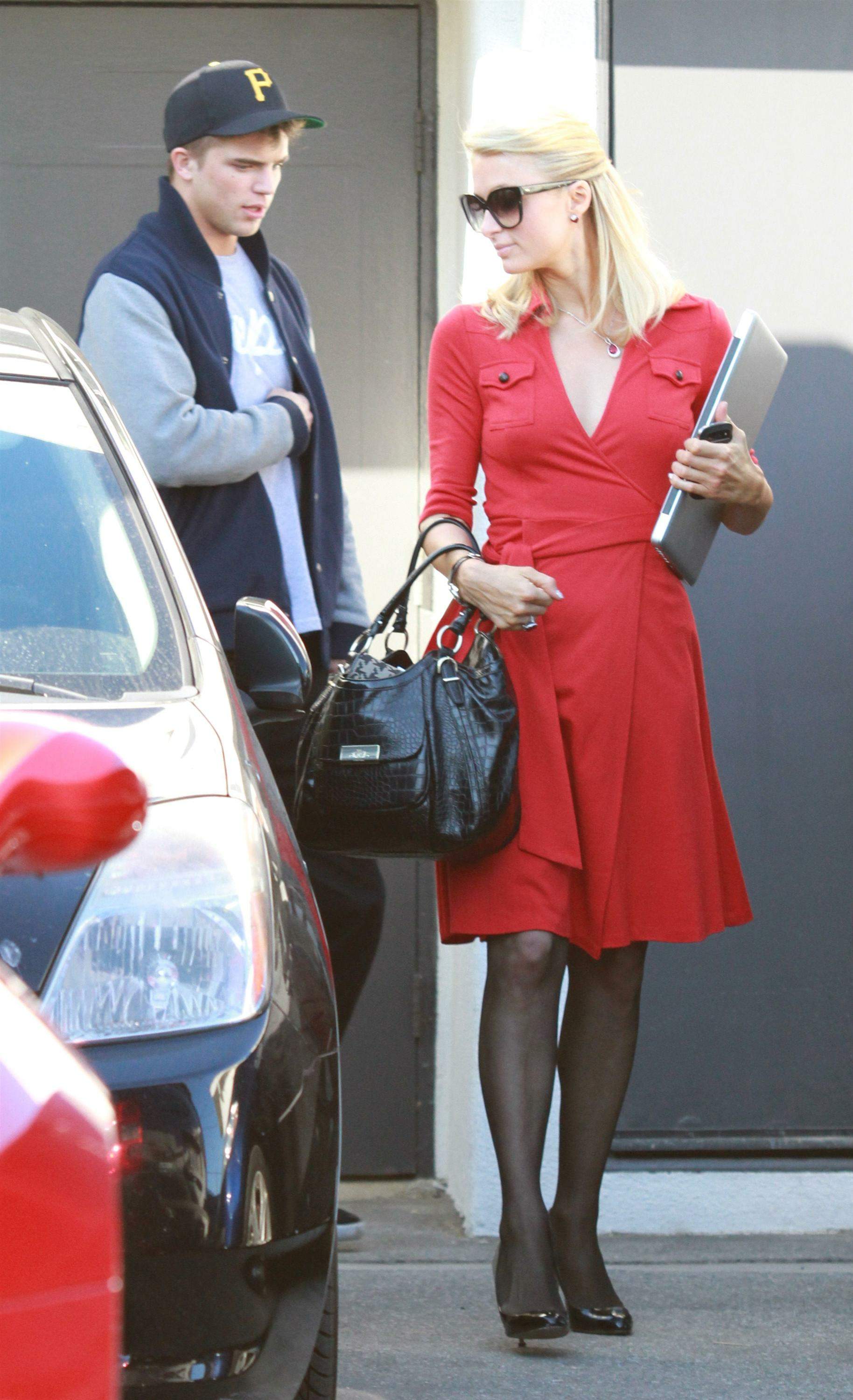Paris Hilton and River Viiperi leave a shopping trip where Paris gets into her red Ferrari February 13, 2013 
