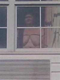 Showing myself in a hotel room in front of an open window