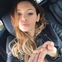 Nabilla Benattia taking a selfie