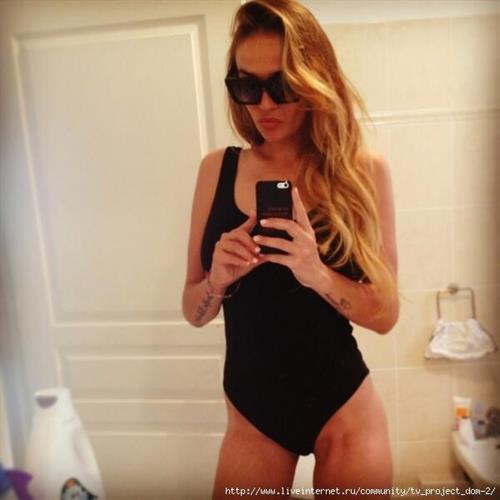 Alena Vodonaeva in a bikini taking a selfie
