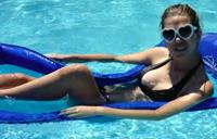 Showing off her great cleavage