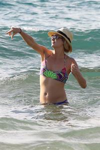 Candice Accola Bikini Pictures Candice Accola in bikini on the beach in Maui, April 15, 2014