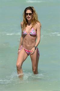 Doutzen Kroes enjoys a day on the beach in Miami Beach, FL on April 28, 2013