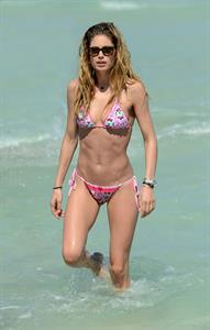 Doutzen Kroes enjoys a day on the beach in Miami Beach, FL on April 28, 2013