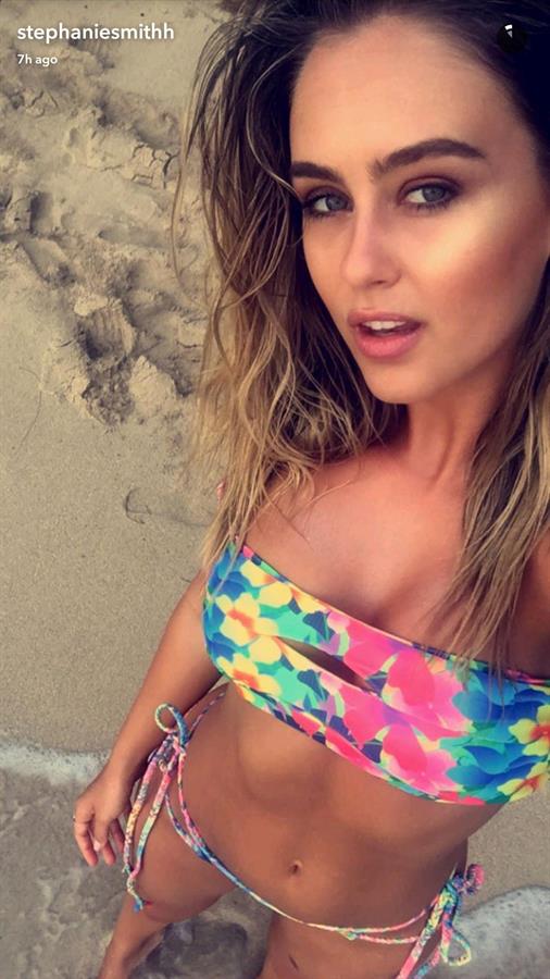Stephanie Claire Smith in a bikini taking a selfie