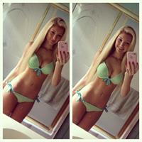 Anna Faith Carlson in a bikini taking a selfie