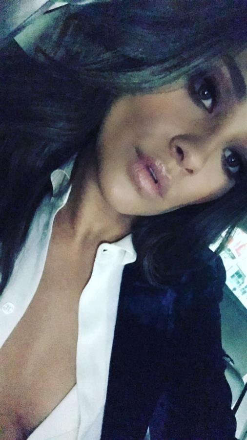 Shay Mitchell taking a selfie