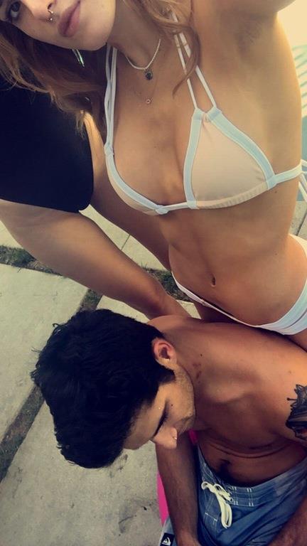 Bella Thorne in a bikini taking a selfie