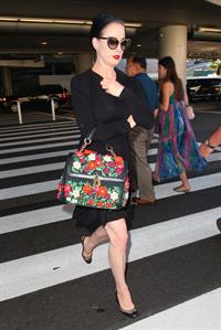 Dita Von Teese arrives from a flight at LAX August 20, 2014