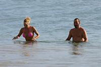 Pamela Anderson Wearing bikini on the beach in Hawaii - August 8, 2013 