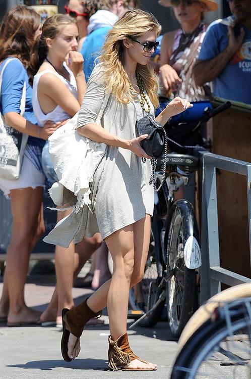 AnnaLynne McCords dress blew up to reveal her underwear in Venice, August 20, 2014