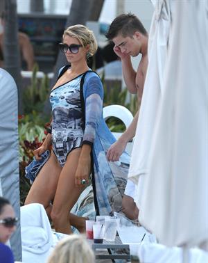 Paris Hilton spends the day in and out of the pool in Miami December 8, 2012
