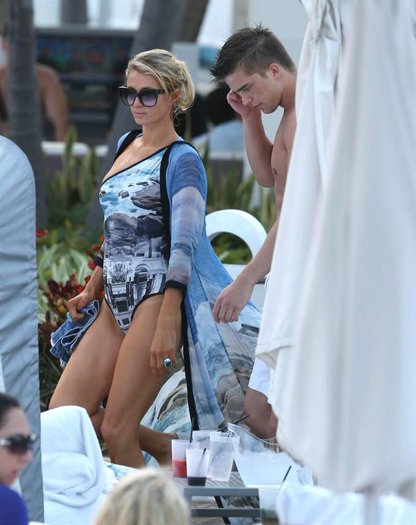 Paris Hilton spends the day in and out of the pool in Miami December 8, 2012