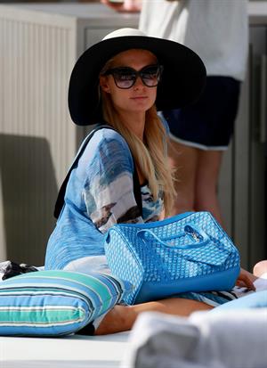 Paris Hilton spends the day in and out of the pool in Miami December 8, 2012