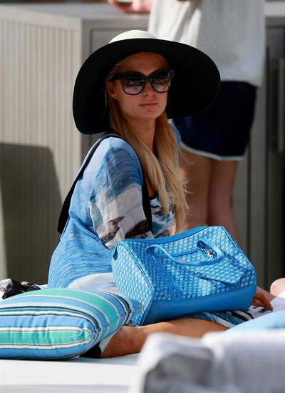 Paris Hilton spends the day in and out of the pool in Miami December 8, 2012