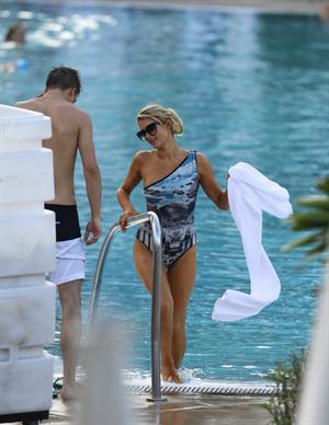 Paris Hilton spends the day in and out of the pool in Miami December 8, 2012