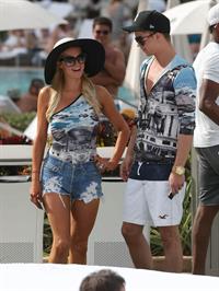 Paris Hilton spends the day in and out of the pool in Miami December 8, 2012