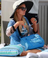 Paris Hilton spends the day in and out of the pool in Miami December 8, 2012
