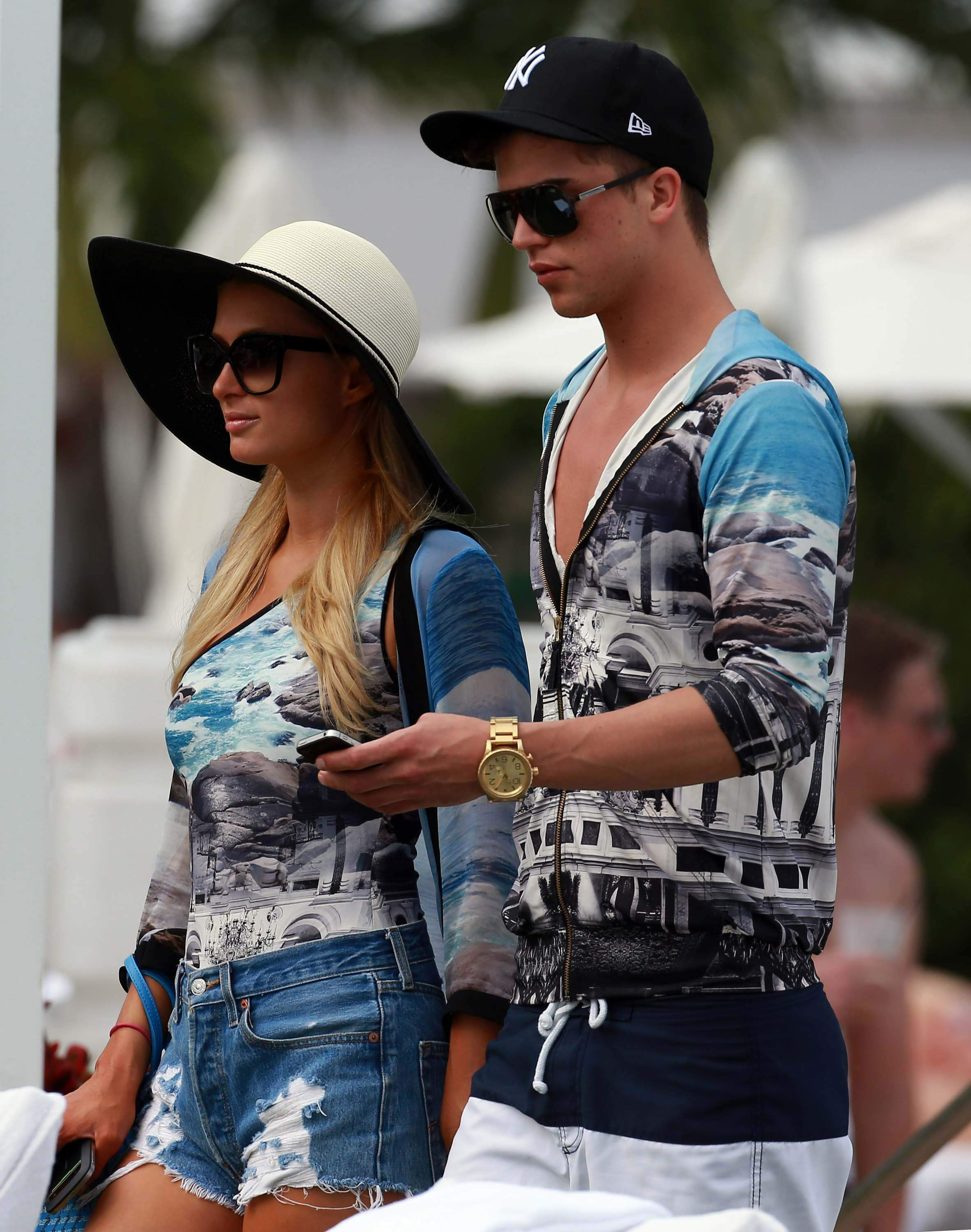 Paris Hilton spends the day in and out of the pool in Miami December 8, 2012