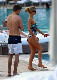 Paris Hilton spends the day in and out of the pool in Miami December 8, 2012
