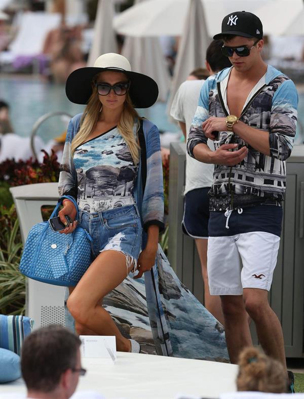 Paris Hilton spends the day in and out of the pool in Miami December 8, 2012