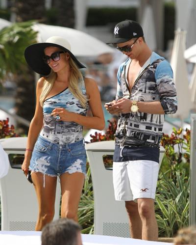 Paris Hilton spends the day in and out of the pool in Miami December 8, 2012