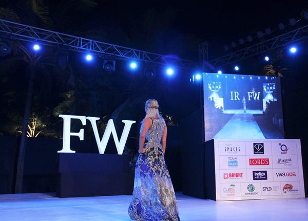 Paris Hilton walks for designer duo Shane and Falguni Peacock and performs as a DJ at the India Resort Fashion Week