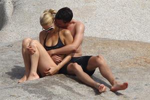 Paris Hilton - Wearing a swimsuit at a beach in France August 6, 2012