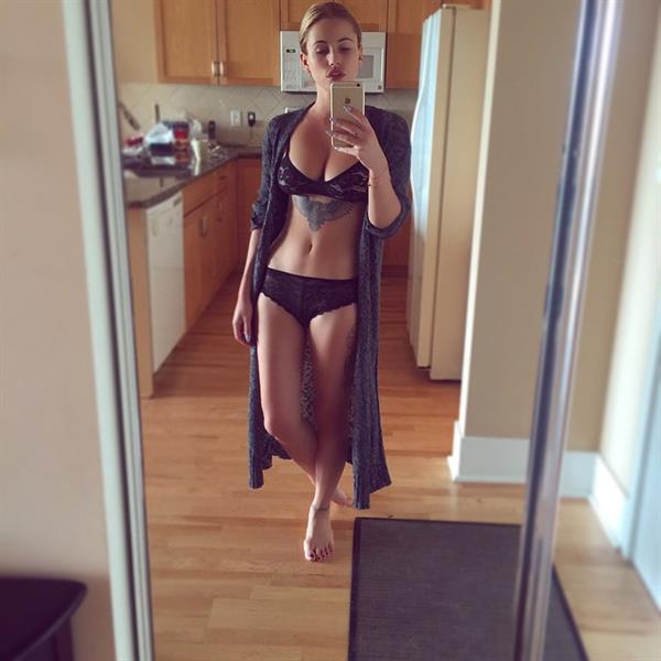 Gaelle Garcia in a bikini taking a selfie