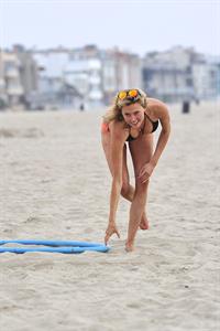 Estella Warren in a bikini with a hula hoop in Venice Beach on August 12, 2014
