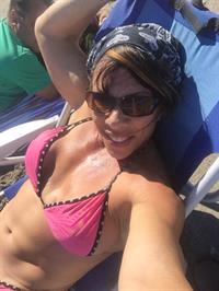 Sondra Faas in a bikini taking a selfie