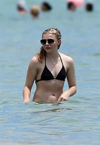 Chloe Grace Moretz candids in a Black Bikini in Miami Beach