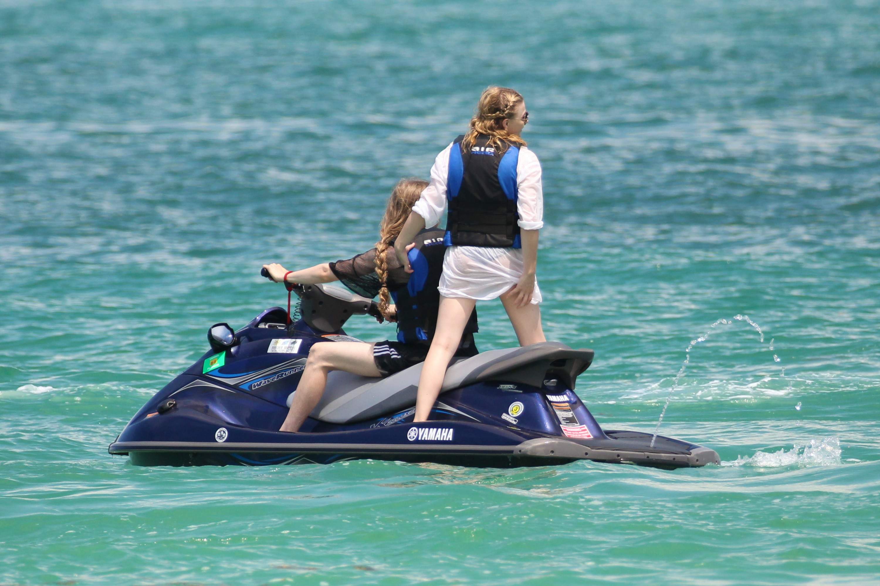 Chloe Grace Moretz candids in a Black Bikini in Miami Beach