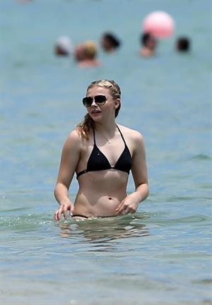 Chloe Grace Moretz candids in a Black Bikini in Miami Beach